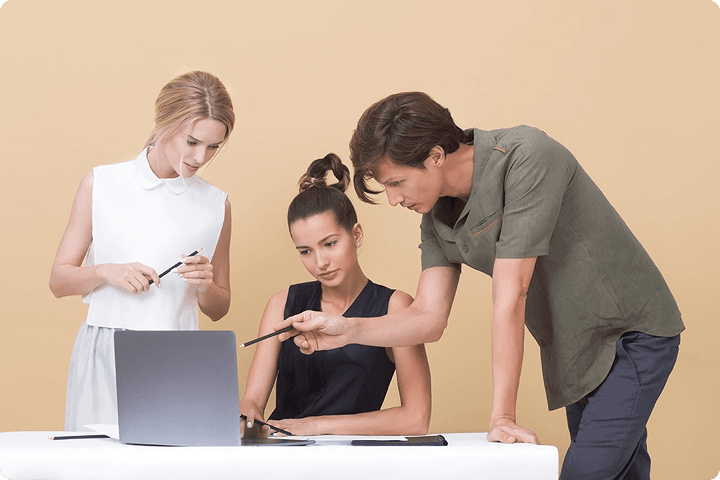 People working on laptops at a table